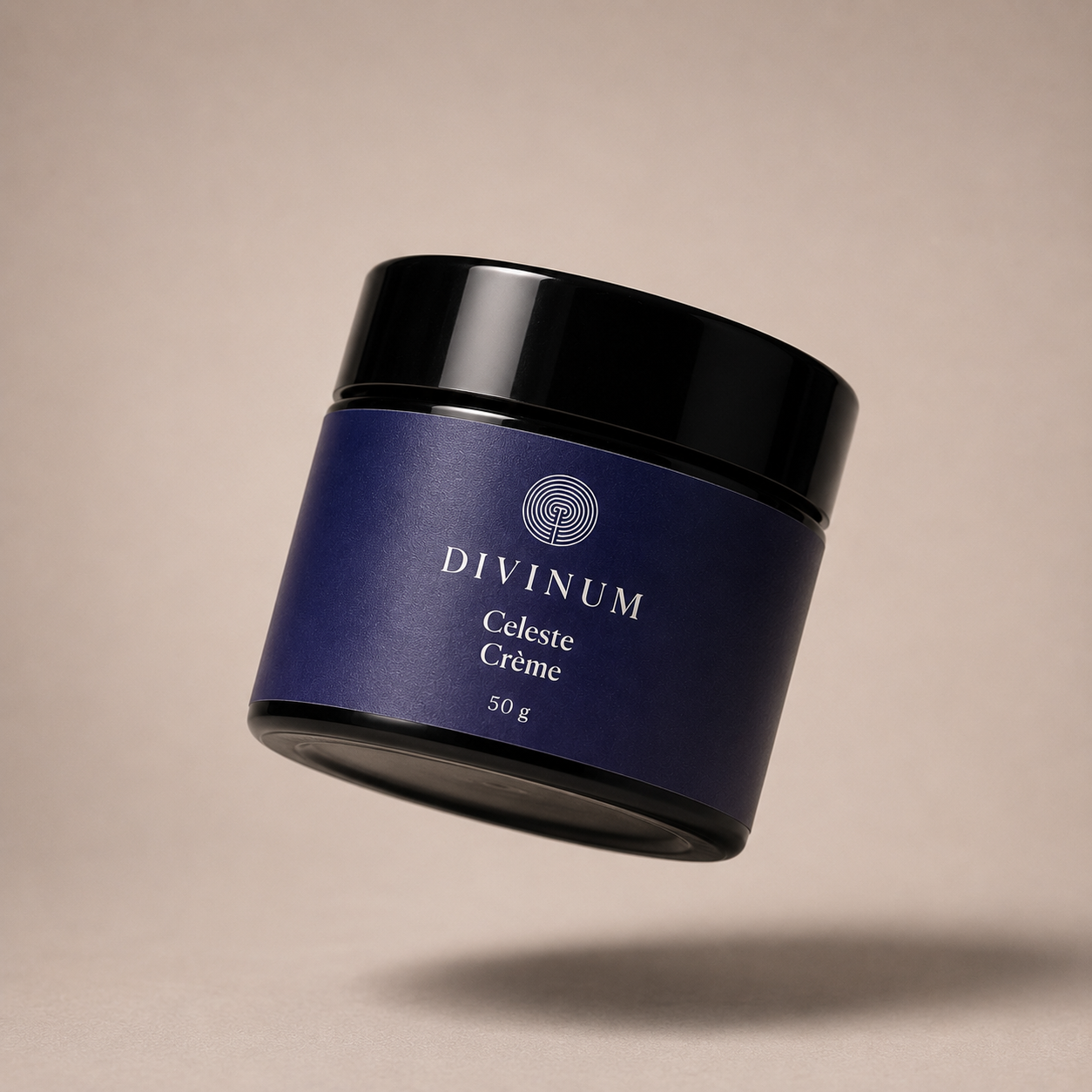 A floating cosmetic jar of Divinum Celeste Crème 50g, featuring a deep purple label and a black lid, set against a solid beige background with a soft shadow below.