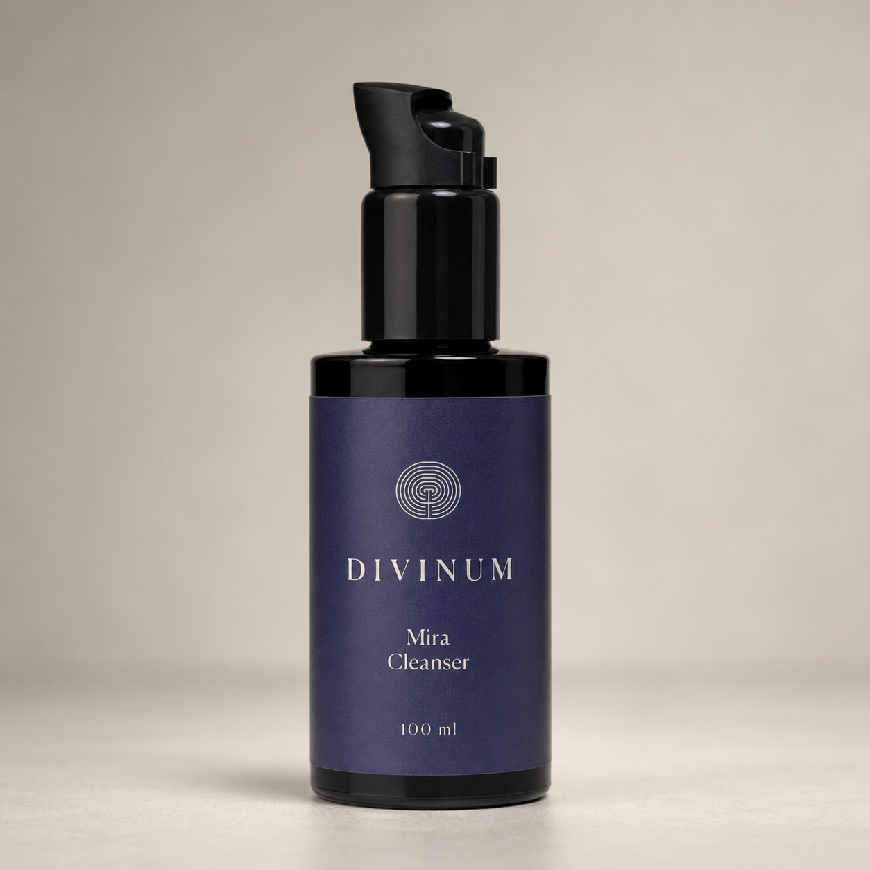 A 100 ml bottle of Divinum Mira Cleanser with a dark purple label and a violet pump dispenser, set against a neutral beige background.