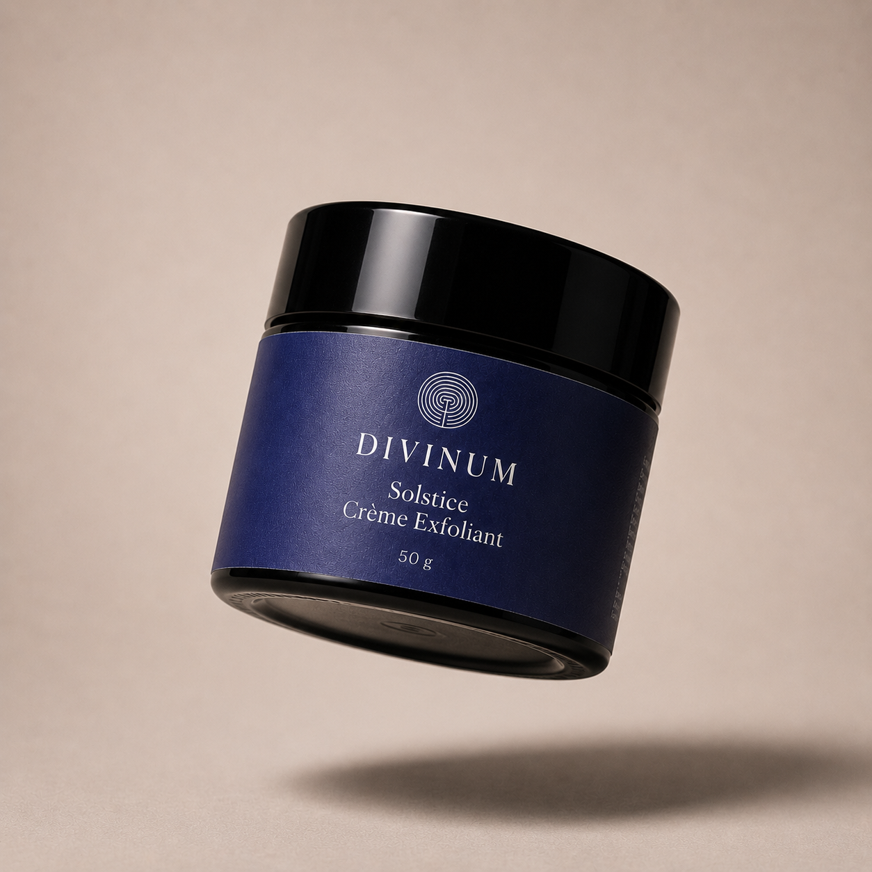 A floating cosmetic jar of Divinum Solstice Crème Exfoliant, featuring a deep purple label and a black lid, set against a warm beige background with a soft shadow below.